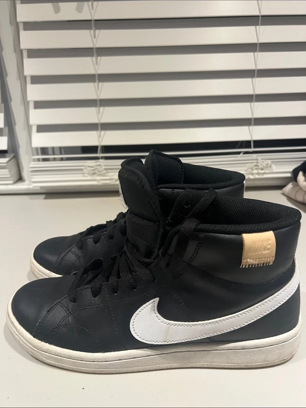 Nike Black High-Top Sneakers with White Soles and White Tongue Logo